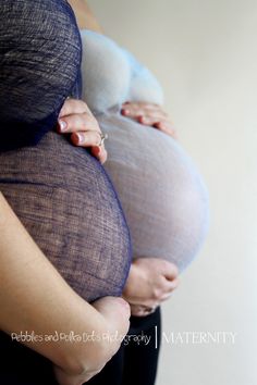 a pregnant woman is holding her belly