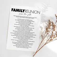 a family reunion poem sitting on top of a table next to some dried plant stems