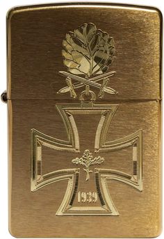 a gold colored lighter with a cross on it