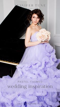 a woman in a purple dress standing next to a piano with the words wedding dresses on it