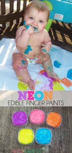 a baby sitting in a chair with paint all over it's body and hands