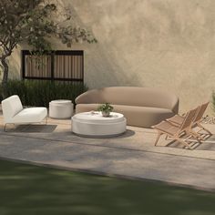 an outdoor living area with furniture and plants