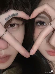 two girls with their hands in the shape of letters that spell out sharp and thin