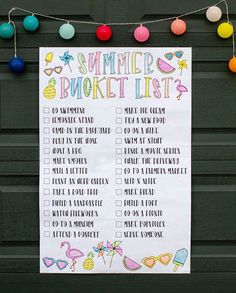 a summer bucket list is hanging on a garage door with colorful balls and string lights