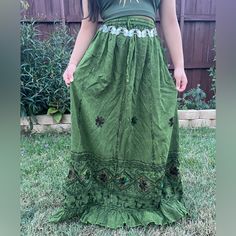 Green Embroidery Maxi Skirt, Perfect For Embracing Those Boho Hippie Vibes! This Stunning Skirt Features Pleated Boarder That Adds A Touch Of Elegance, While The Maxi Length Offers A Chic And Comfortable Fit.Crafted With Fairycore Fashion In Mind, This Skirt Is Ideal For Creating Enchanting Cottage Core Looks. Whether You're Strolling Along Sandy Shores Or Exploring Hideaways, This Skirt Will Ensure You're Dressed To Impress. Its Flowing Silhouette Captures The Essence Of Fairycore Aesthetics, E Embroidered Mini Skirt For Festival, Bohemian Embroidered Mini Skirt, Bohemian Long Skirt With Embroidery, Traditional Green Summer Skirt, Bohemian Long Embroidered Skirt, Green Lined Skirt Bottoms For Festival, Bohemian Embroidered Maxi Skirt For Summer, Green Lined Skirt For Festival, Bohemian Embroidered Skirt For Vacation