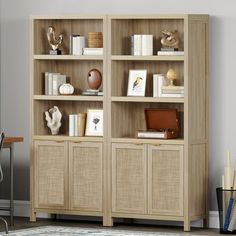 a wooden bookcase with wicker doors and drawers in a living room next to a rug