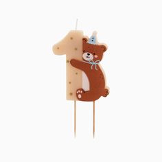 a birthday candle with a bear on it