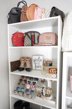 a white shelf filled with lots of purses and handbags on top of it