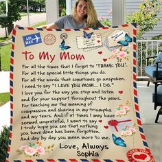 a woman standing next to a sign that says to my mom