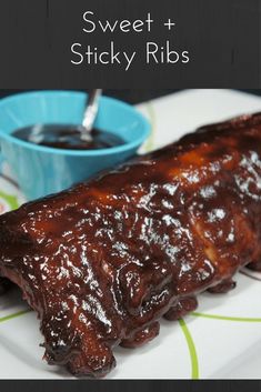 the ribs are covered in bbq sauce and ready to be served with dipping sauce