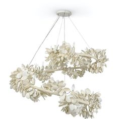 a chandelier with white flowers hanging from it