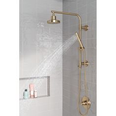 the shower head and handset are connected to the wall with water running from it