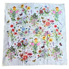 This exquisite Gucci scarf, a true vintage treasure, remains in unused condition, having been carefully preserved in its original packaging since the 1970s. It is a remarkable piece from my family's personal collection, now available for a discerning collector. Featuring the iconic floral pattern that Gucci introduced in 1966, this scarf is a testament to timeless elegance. Originally designed for the beloved Princess Grace Kelly of Monaco, the design combines a delicate arrangement of insects, Gucci Fabric, Flora Vintage, White Silk Scarf, Gucci Flora, Gucci Floral, Princess Grace Kelly, Gucci Scarf, Mario Testino, Gucci Outfits