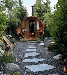 a garden area with stepping stones and a fire place