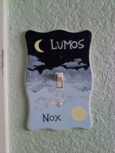 a light switch cover that says lumos and nox with the moon in the sky