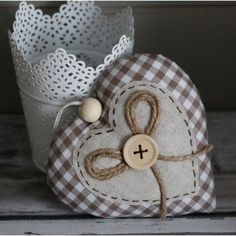 a heart shaped object sitting on top of a wooden table