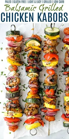 grilled chicken kabobs on skewers with tomatoes and cucumbers