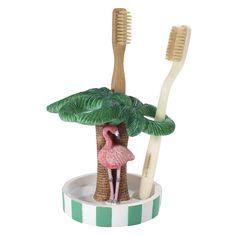 two toothbrushes in a palm tree holder