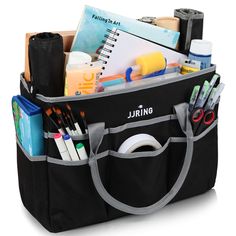 a large black bag filled with school supplies