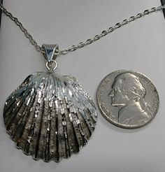 "Vintage Seashell necklace in sterling silver, silver seashell jewelry, beach jewelry. This seashell necklace is beautiful clean & polish and in good vintage condition. Seashell pendant size: Length: 1.75\" Width: 1.25\" width Chain: 18\" long" Silver Shell Jewelry For Beach, Elegant Silver Shell Necklace For Beach, Silver Shell Jewelry, Silver Shell Necklace As A Gift, Silver Shell Gift, Silver Shell Necklace Perfect For Gifts, Silver Shell Shaped Jewelry, Seashell Silver Jewelry, Elegant Silver Shell Beach Necklace