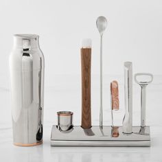 a set of kitchen utensils sitting on top of a counter