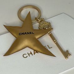 Chanel Star Comet Key Charm Coco Crush Promotional Merchandise New Coco Chanel Charms, Disco Key Chains, Chanel Favors, Chanel Hangers, Chanel Charm, Coco Crush, Promotional Merchandise, Slouch Socks, Chanel Accessories