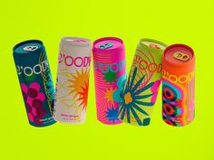 three different types of soda cans on a green background