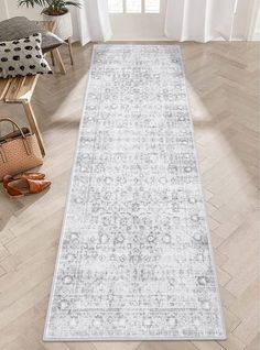 a white and gray rug in a living room