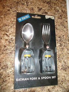 two forks and spoons in the packaging for batman fork & spoon set on a counter