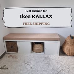 a white bench sitting next to a wall with the words ikea kallax on it