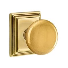 an antique brass door knob on a white background