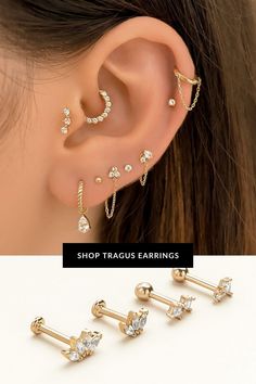 three pairs of ear piercings with crystal stones