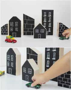 a person is playing with black and white paper houses