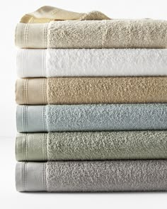 towels stacked on top of each other in different colors