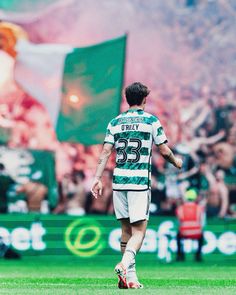 a soccer player is walking on the field