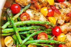 chicken, asparagus and cherry tomatoes in a pan