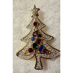 Add A Touch Of Sparkle To Your Holiday Wardrobe With This 2001 Retired Swarovski Christmas Tree Pin. The Pin Features A Beautiful Tree-Shaped Design And Is Adorned With Colorful Rhinestones That Will Catch The Eye Of Everyone In The Room. The Pin Is Made Of Yellow Gold-Plated Metal And Is Perfect For Adding A Festive Touch To Your Outfit During The Holiday Season. This Swarovski Pin Is Perfect For Those Who Love To Accessorize And Want To Make A Statement During The Holiday Season. The Pin Is Ideal For Those Who Want To Add A Touch Of Elegance And Sparkle To Their Outfit . Add This Beautiful Pin To Your Collection Today And Bring Some Holiday Cheer To Your Wardrobe. The Pin Is In Very Exce Swarovski Christmas Tree, Swarovski Christmas, Holiday Wardrobe, Swarovski Jewelry, Beautiful Tree, Holiday Cheer, Red Gold, Red Yellow, The Holiday