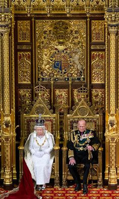 the queen and prince are sitting on gold thrones