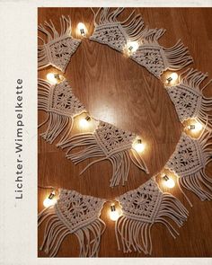 a white doily with lights on it and some string lights in the shape of a circle