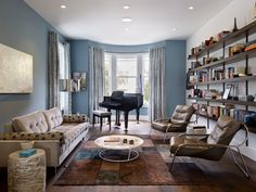 a living room filled with furniture and a piano