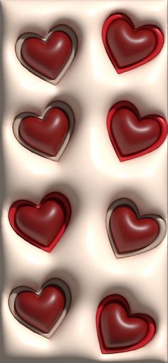 several red hearts are arranged in the shape of heart shapes on a white background with shadows