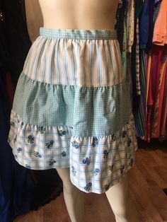 "Vintage petite Bobbie Brooks tiered spring skirt. Excellent condition. Measurements: 24\" waist 48\" hip 18\" length" Tiered Ruffle Cotton Skort, Tiered Ruffle Skort, Tiered Blue Skirt With Ruffles, Cotton Tiered Skort With Gathered Skirt Detail, Cotton Tiered Skort With Lined Skirt, Cotton Tiered Skort With Gathered Skirt, Spring Fitted Tiered Mini Skirt, Fitted Tiered Mini Skirt For Spring, Blue Tiered Skirt For Spring