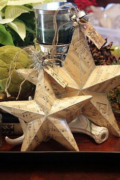 an ornament made out of sheet music sits on a table