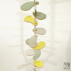 a tall metal pole with several different colored discs hanging from it