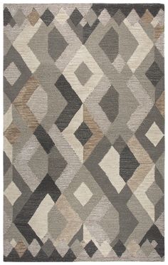 an area rug with various shapes and colors on the floor, including greys, beiges