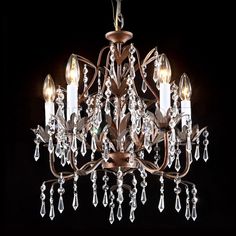 a chandelier with crystal drops hanging from it's center and two lights on each side