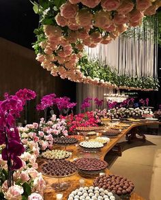 a long table filled with lots of cakes and cupcakes on top of it