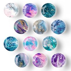 marbles with different colors and designs on them are arranged in the shape of circles