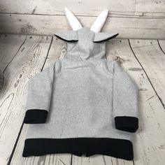 "Fleece Goat Toddler Sweatshirt This is a fleece goat hooded sweatshirt made from 100% polyester fleece. Features: -Lined hood with ears, eyes, nose, and stuffed horns -Pockets on front with felt footprint details -Cuffs and bottom band Shown is a size 2/3T on a mannequin measuring 38\" tall This goat hoodie is available in sizes 2/3T-5/6T and others upon request. Perfect gift for an animal lover! Care: Machine wash cool, gentle Tumble dry low" Gray Fleece Sweatshirt With Fleece Lining, Gray Fleece-lined Sweatshirt, Gray Fleece-lined Hoodie For Winter, Gray Fleece-lined Hooded Hoodie, Gray Fleece Hoodie With Drawstring, Gray Hooded Hoodie With Fleece Lining, Gray Long Sleeve Hoodie With Fleece Lining, Fleece Hooded Sweater With Double-lined Hood, Gray Fleece Hoodie For Outdoor