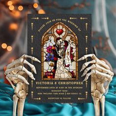 a skeleton holding up a wedding card with the bride and groom on it in front of a stained glass window